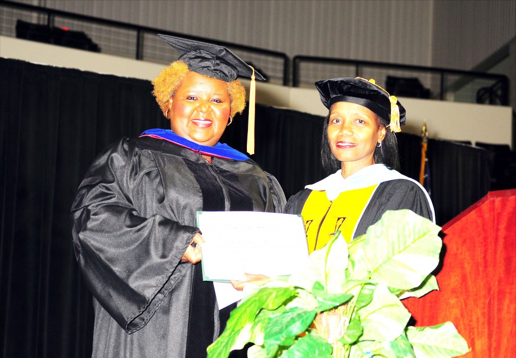 AKANE SIMPSON/The Gramblinite Graduation speaker Dr. LaQuieta Huey (left) receives a gift from Grambling High and Middle Magnet School principal, Dr Pamela Payne.
