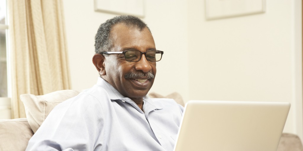 Senior African American man on a laptop
