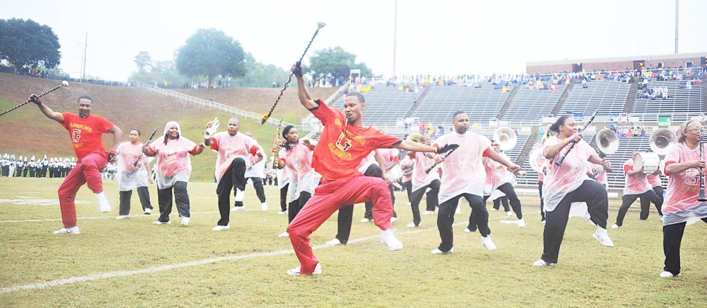 Despite the rain — and the intervening years — the alumni band from drum majors to tuba players show they still know how to do the World Famed Tiger Marching Band moves. They performed Saturday at halftime of the Homecoming football game.