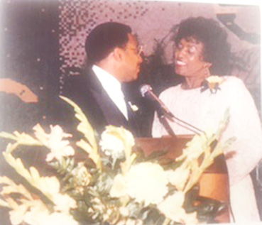 Courtesy photo Mrs. Mildred Moss stands with then GSU President Joseph B. Johnson in the Black and Gold Room.